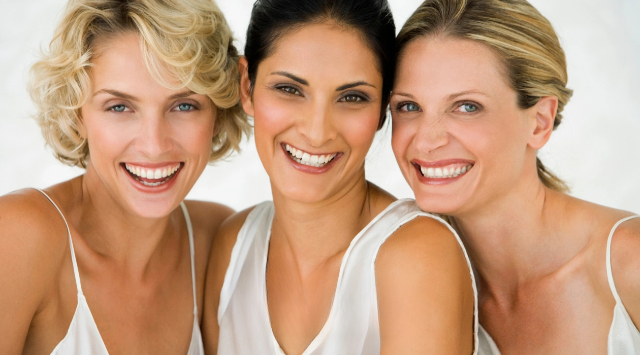 Smiling women illustrating GainsWave for Her treatment and intimate wellness at Ovation Med Spa in Houston, Texas.